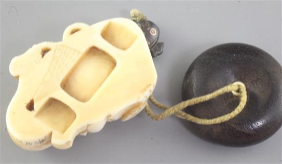 A Japanese ivory noh mask netsuke and an erotic manju ivory and wood netsuke, late 19th / early 20th century, height 4.7cm and 3.3cm